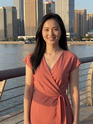 Mei, 26, Chinese woman from Shenzhen on modern waterfront promenade