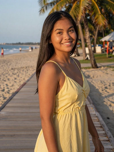Maria Fe, 24, Filipino woman from Davao on a tropical beach boardwalk