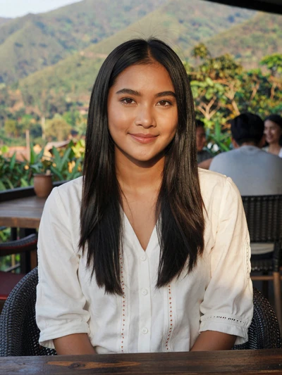 Kanya, 25, Thai woman from Chiang Rai at outdoor mountain cafe
