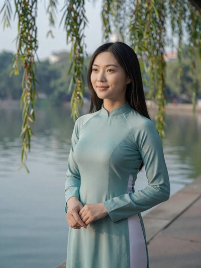 Trang, 27, Vietnamese woman from Hanoi beside lake
