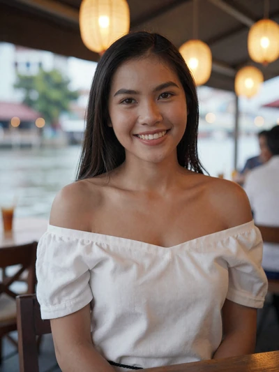 Nong, 29, Thai woman from Bangkok at riverside restaurant